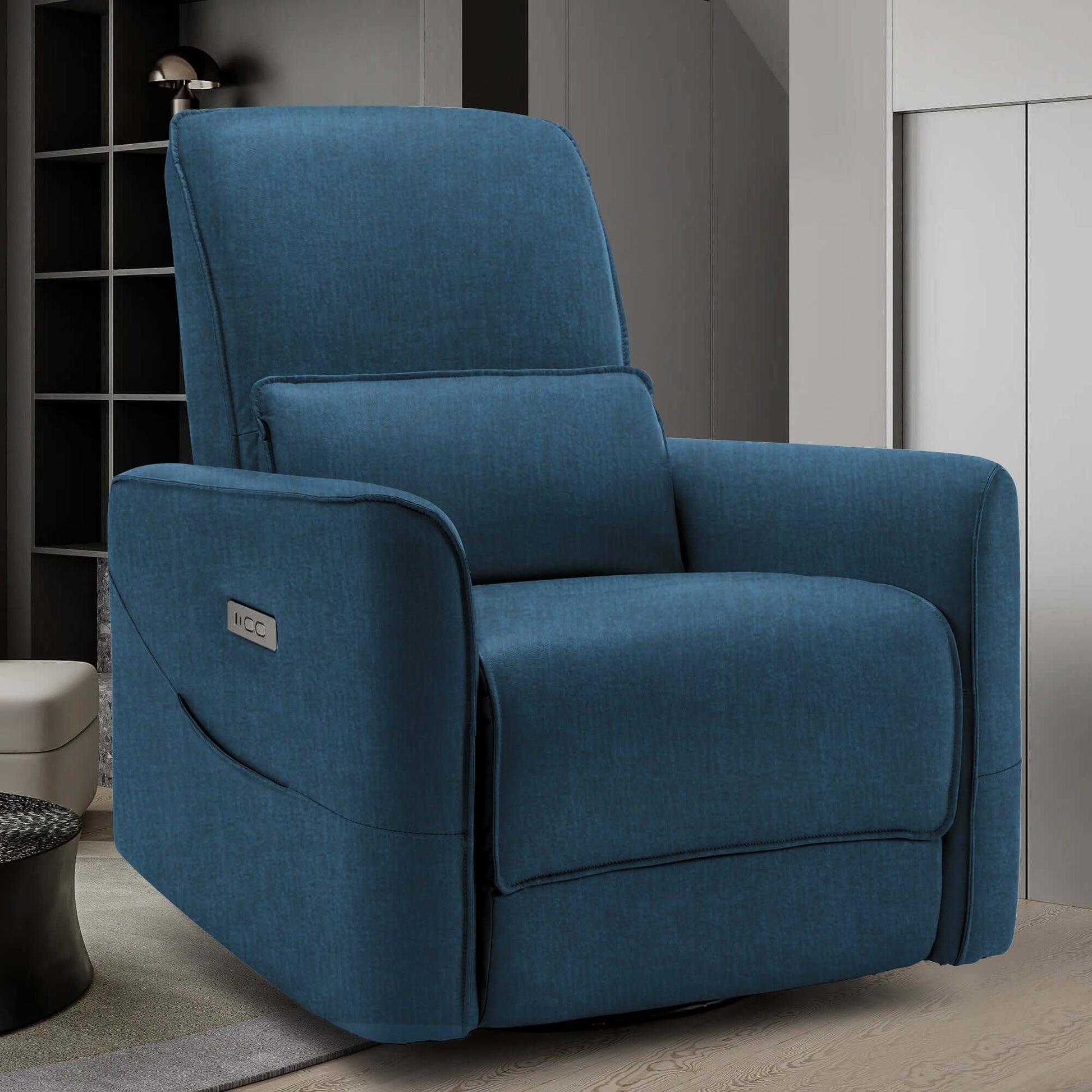 Swivel recliner chair in teal fabric, designed for nursery use and featuring a power rocking mechanism.
