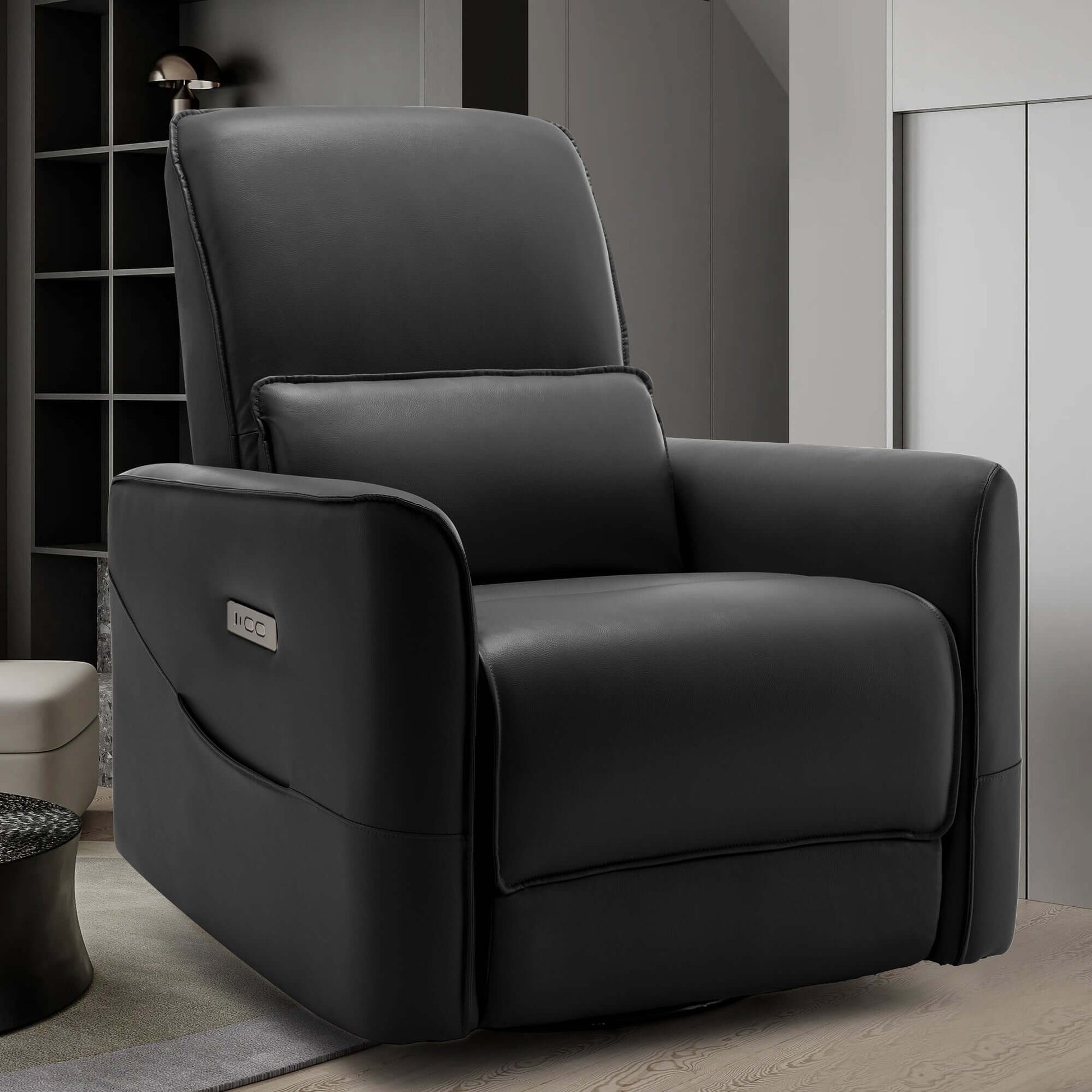 Swivel recliner chair in black faux leather, perfect for nursery rocking and relaxation with power recline feature.